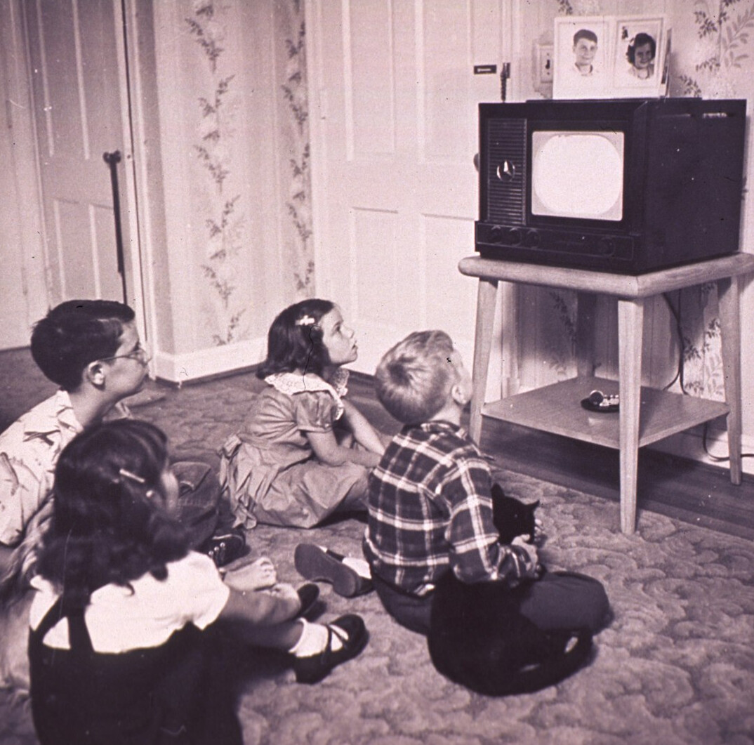 family watching old tv
