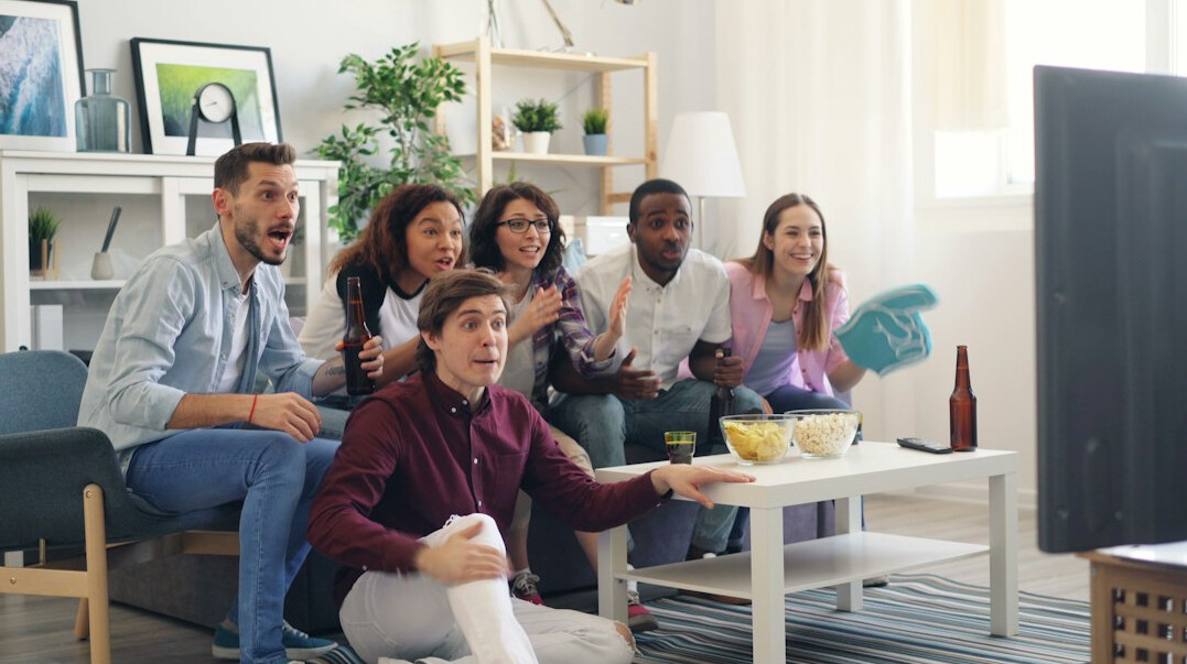 group watching tv together